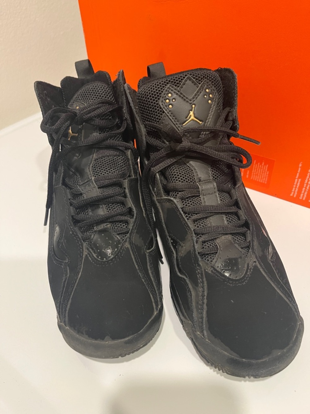 Jordan Black High-Top Sneakers with Gold Jumpman